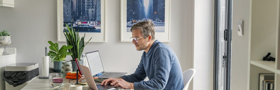 Person organizing digital accounts on a laptop, symbolizing incorporating digital assets into an estate planning strategy.